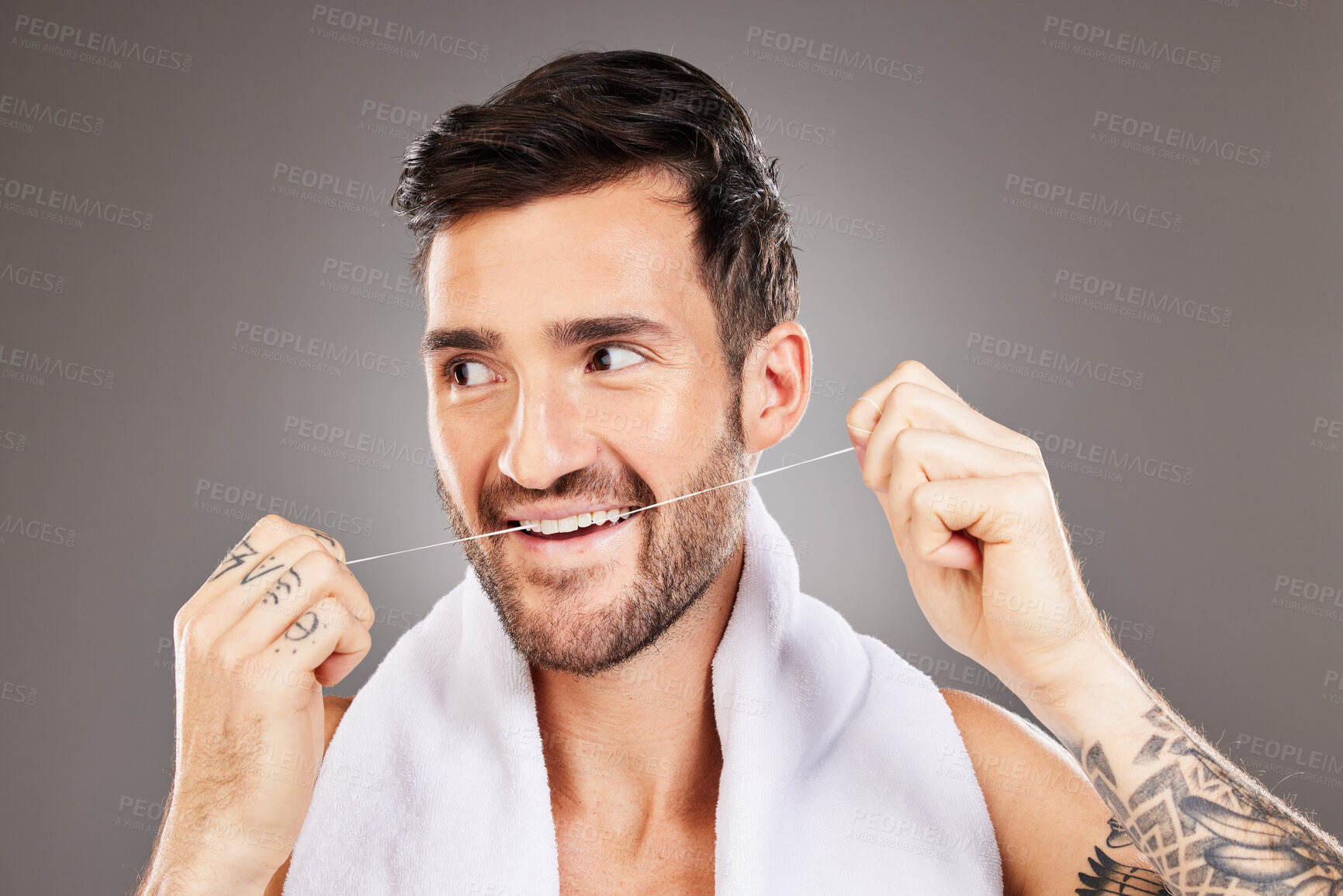 Buy stock photo Teeth, dental floss and cleaning man in studio isolated on gray background. Oral care, dental health and happy male model from Australia tooth flossing for gum care, wellness or healthy mouth hygiene