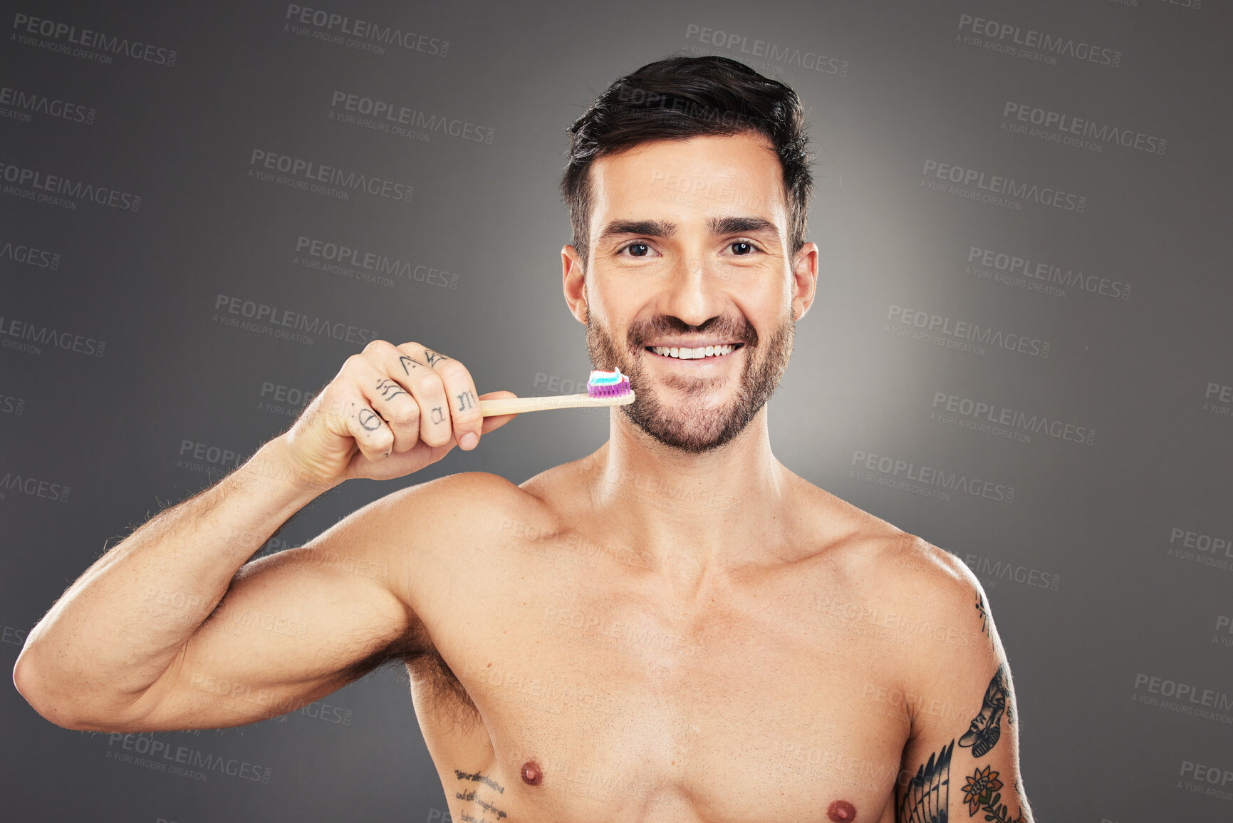 Buy stock photo Dental hygiene, man and brushing teeth for health, wellness and body care against grey background. Portrait, oral health and male with toothbrush, fresh breath and healthy with smile and toothpaste.