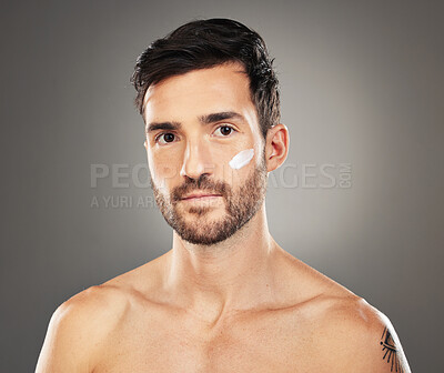 Buy stock photo Face cream, skincare and beauty portrait of man in studio isolated on gray background. Wellness, health and male model from Canada with facial creme, moisturizer or cosmetics product for healthy skin