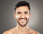 Skincare, health portrait of man with cream on face for anti aging and glowing skin on studio background. Beauty, facial and male model with luxury product for healthy skin treatment and self care.