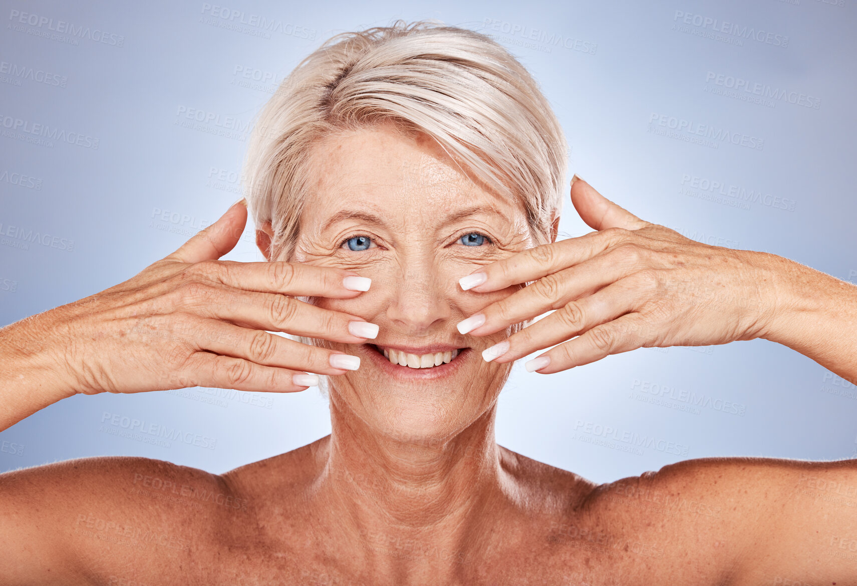 Buy stock photo Senior woman, face and beauty manicure, skincare and smile for face wellness, healthcare or anti aging against a grey studio background. Happy elderly model, cosmetic, nails and hands with clean skin