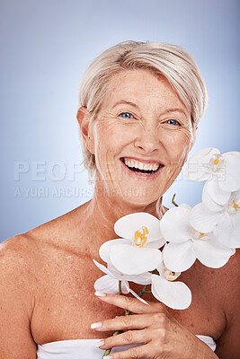 Buy stock photo Mature woman, portrait and beauty with a flower for organic or natural skincare and bodycare. Face, senior female and floral cosmetology or dermatology treatment for facial antiaging wellness