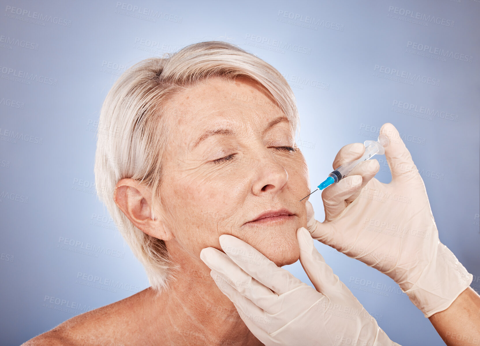 Buy stock photo Botox, injection and senior woman with hands of doctor for medical beauty against grey studio background. Skincare, wellness and elderly patient with plastic surgery for facial lifting and cosmetics