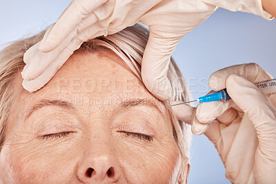 Face, hand and syringe for botox, cosmetic surgery and beauty against a grey studio back with mockup, Senior woman with Plastic surgery, hands and face for collagen, lifting and silicone injection