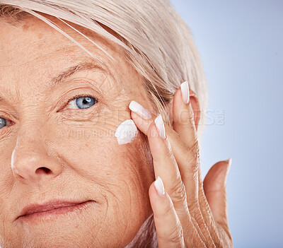 Buy stock photo Senior, skincare and face wellness cream of a woman with cosmetic, beauty and facial product. Portrait of a elderly model with sunscreen, cosmetics and collagen dermatology lotion for anti aging