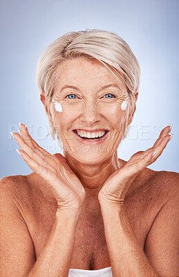 Buy stock photo Beauty, portrait of mature woman and cream for skincare, anti aging and wellness on a grey studio background. Skin care, moisturiser or lotion with a senior female apply suncream or spf on her face