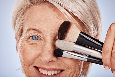Buy stock photo Makeup, beauty and senior woman with brush for face skincare, product choice and foundation promotion in studio. Facial portrait of elderly model artist cover eye for cosmetics skin care marketing 