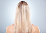 Woman, hair and back of a blonde woman with keratin treatment hairstyle or hair care. Beauty salon, blond hair and hair style or haircare of a lady with healthy, beauty and long healthy hair