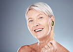 Toothbrush, smile and portrait of a senior woman with a healthy dental routine in a studio. Wellness, cosmetics and happy elderly model with oral care, hygiene and health isolated by gray background.