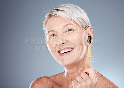 Buy stock photo Toothbrush, smile and portrait of a senior woman with a healthy dental routine in a studio. Wellness, cosmetics and happy elderly model with oral care, hygiene and health isolated by gray background.