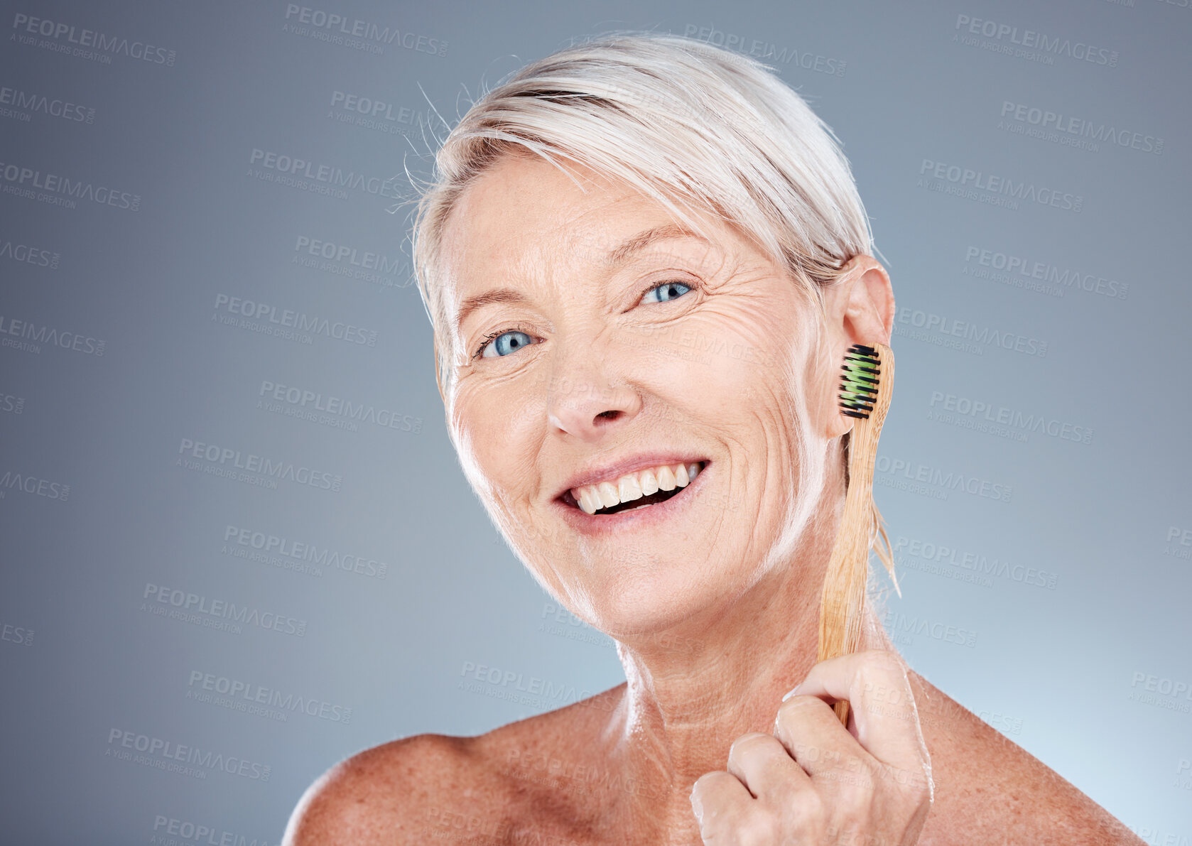 Buy stock photo Toothbrush, smile and portrait of a senior woman with a healthy dental routine in a studio. Wellness, cosmetics and happy elderly model with oral care, hygiene and health isolated by gray background.
