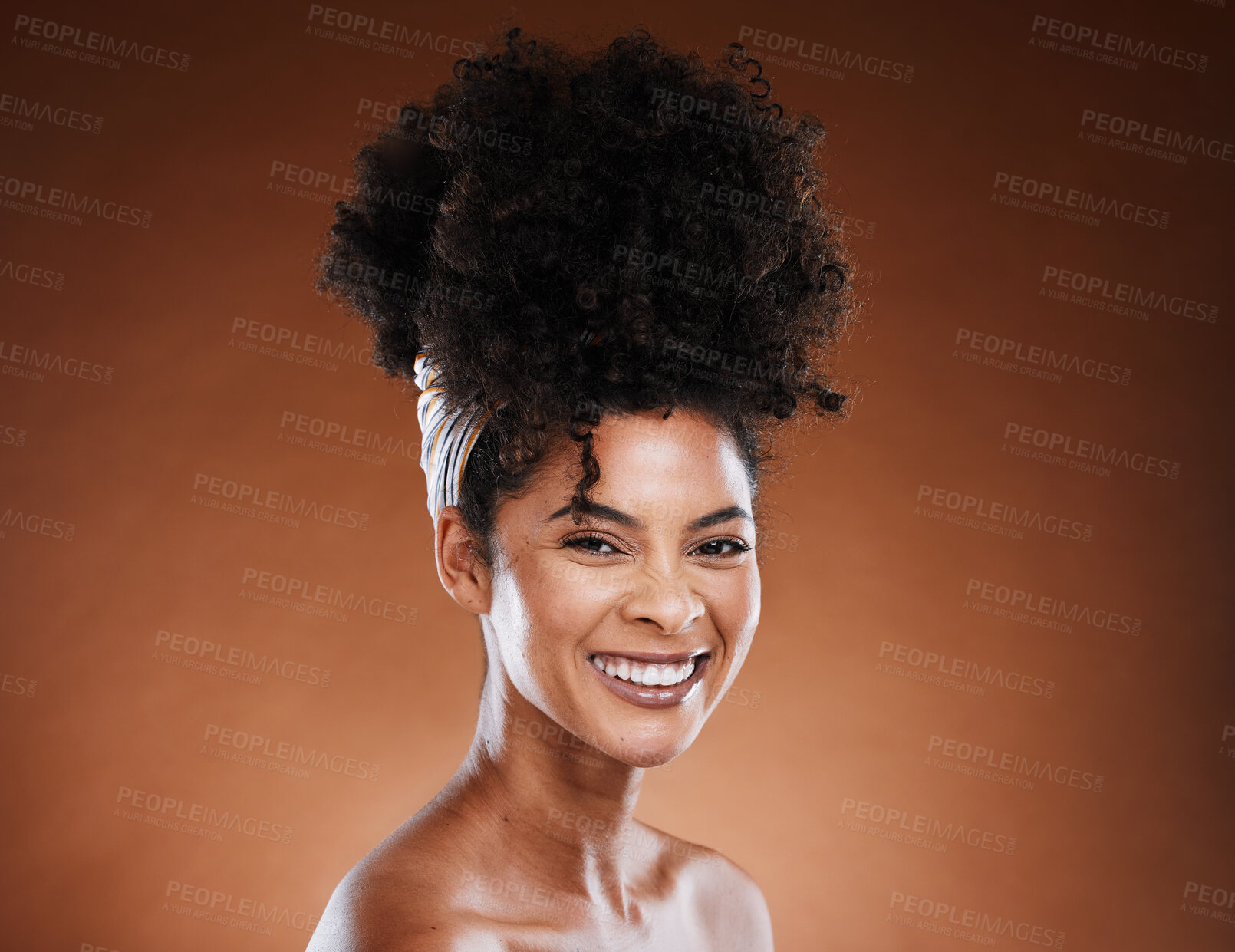 Buy stock photo Black woman, afro hair and cosmetic studio with smile on face for self care, hair care and beauty. Woman, cosmetics model with natural african hairstyle, makeup and wellness by brown background