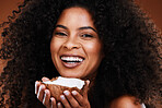 Face, coconut skincare and portrait of black woman in studio isolated on a brown background. Makeup, organic cosmetics and female model holding fruit for antioxidants, coconut oil and healthy skin.