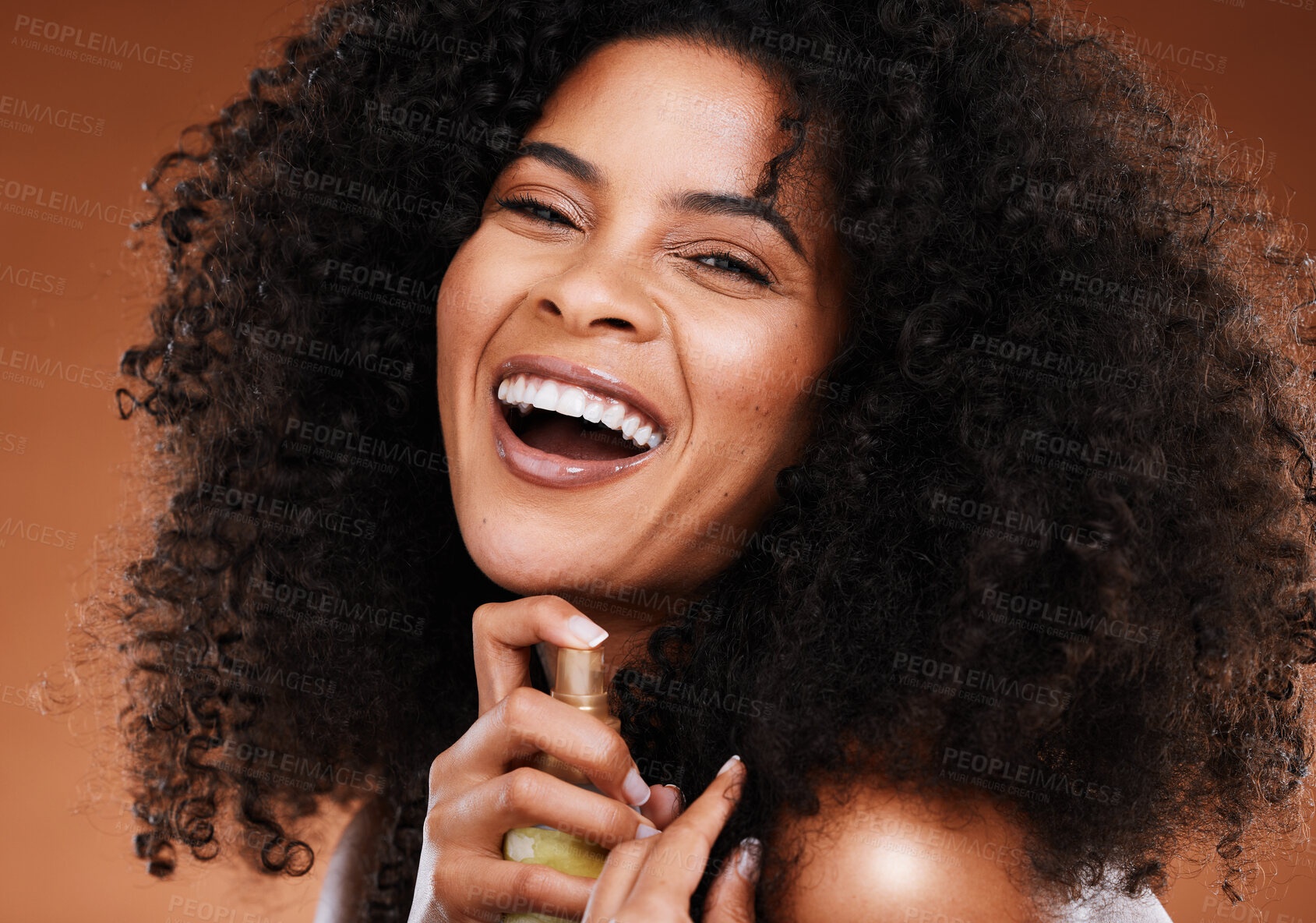 Buy stock photo Hair care, spray and portrait of a black woman with an afro doing a routine with wellness product. Health, cosmetics and happy African model with hairspray for her natural hair by a brown background.