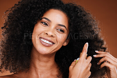 Buy stock photo Black woman, spray and natural hair beauty for shine, healthy and curly texture care bottle. Hair care, happy and oil cosmetic protection product with confident girl model in brown studio.