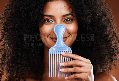 Buy stock photo Black woman face, beauty and comb for hair care, beauty and afro with smile for happy smile in studio background. Portrait of African American female smiling for beauty hairstyle or salon treatment
