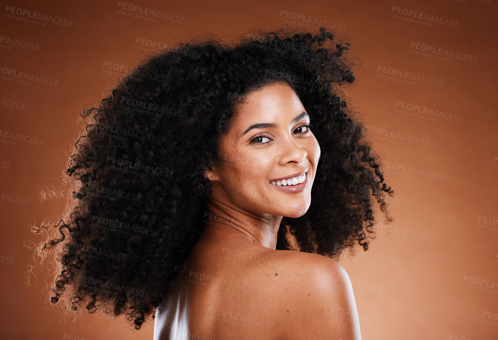 Buy stock photo Curly hair, black woman and natural skincare, beauty and makeup, glowing skin and facial cosmetics, aesthetic wellness and studio background. Portrait of happy young african model, afro and body care