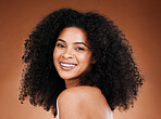 Black woman afro, beauty and smile for skincare, makeup or cosmetics against a studio background. Portrait of African American female smiling with teeth in satisfaction for cosmetic facial treatment