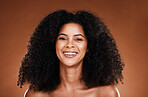 Natural, hair care and black woman in studio portrait for wellness, beauty and luxury with smile happy for shine or glow results. Skin care, healthy hair and young model headshot for salon promotion