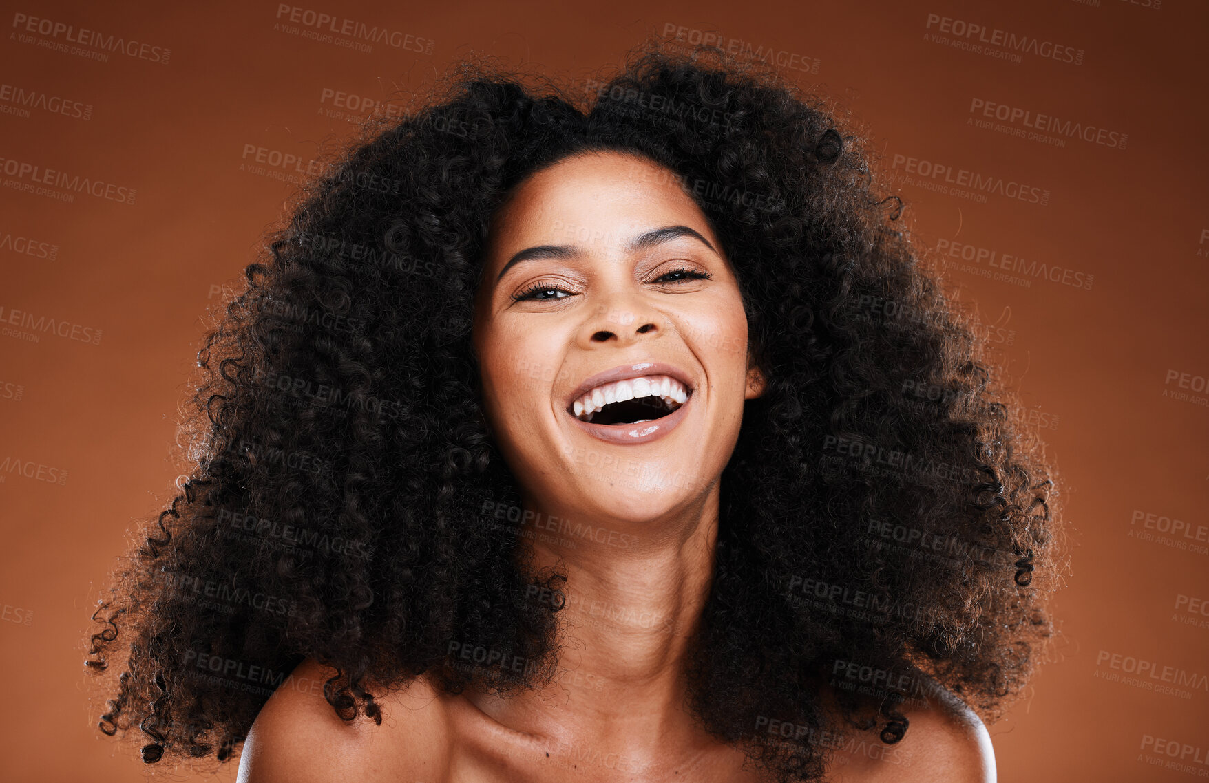 Buy stock photo Beauty, hair care and black woman laughing in studio on brown background for wellness. Fashion, happiness and face portrait of girl with natural, shiny and healthy afro hair smiling for hair salon