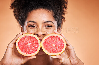 Buy stock photo Grapefruit, black woman and vitamin c beauty, skincare and wellness, healthy body and aesthetics, natural cosmetics and face on studio background. Portrait of african model, citrus nutrition and diet