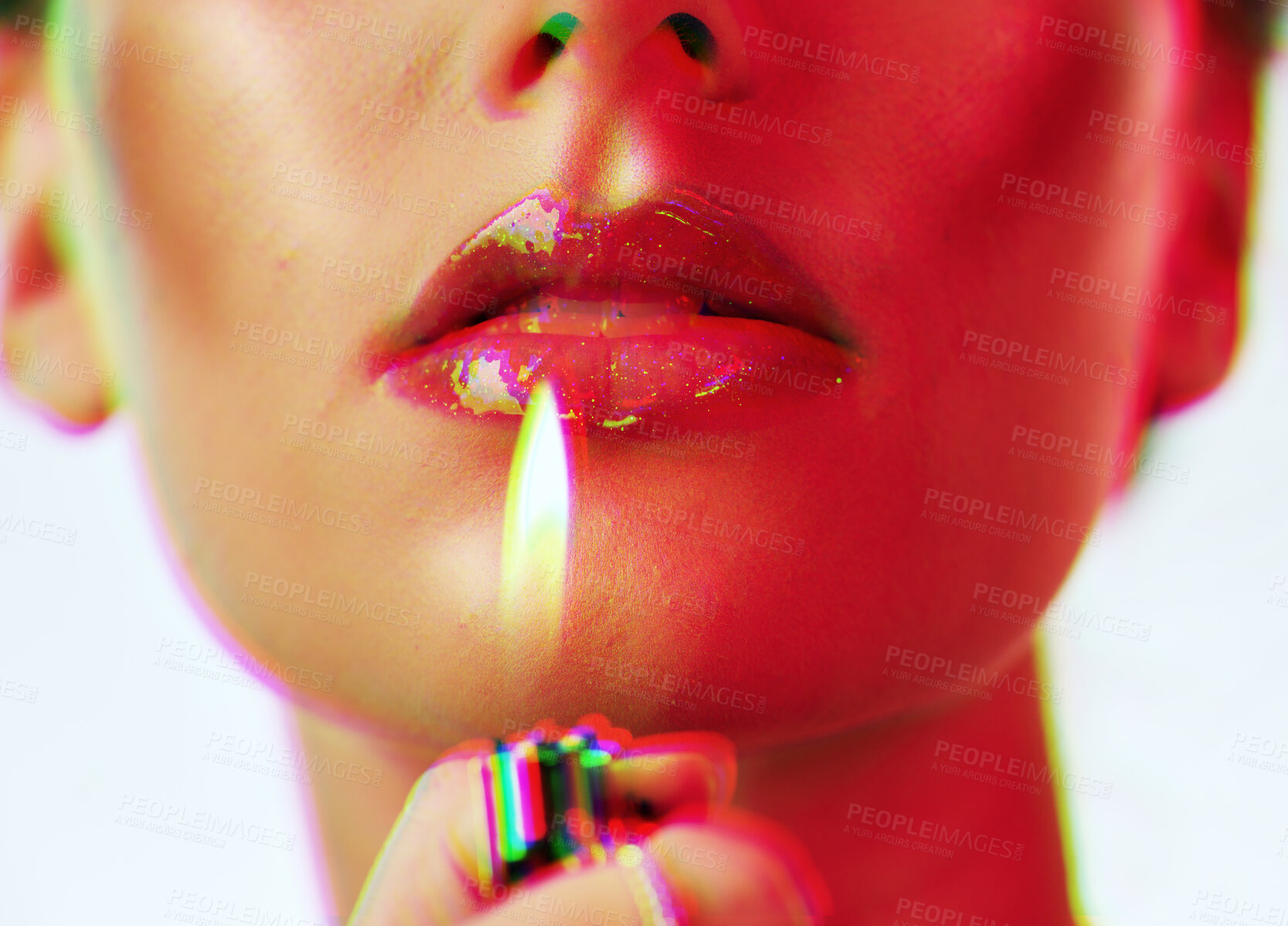 Buy stock photo Makeup, beauty and woman with mouth lighter flame for an edgy, gen z and futuristic cosmetic campaign. Neon hologram face effect on shiny lip gloss cosmetics model zoom in white studio.

