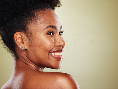 Buy stock photo Skincare, beauty and black woman in a studio for a health, wellness and cosmetic face routine with mockup space. Happy, smile and African model with a natural facial treatment by a green background.