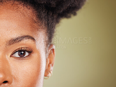 Buy stock photo Beauty, black woman and half face portrait for dermatology, facial or skincare advertising. Wellness, health and natural skin cosmetic zoom of model with green studio mockup for marketing.

