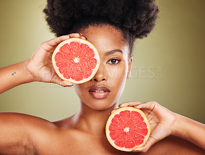 Buy stock photo Grapefruit, face and studio black woman for natural skincare, healthy glow and cosmetics with green vegan product, detox or food promotion. Beauty model portrait with vitamin c fruits for dermatology