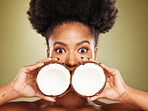 Skincare, beauty and portrait of black woman with coconut in studio on brown background. Wellness, body care and eyes of girl with fruit for healthy, organic and natural cosmetic products and makeup
