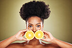Black woman, skincare portrait and lemon in hands for beauty, wellness or self care by wall. African model, cosmetic woman or vitamin c fruit for health, face care or cosmetics by studio background
