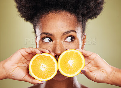 Buy stock photo Black woman, face or thinking of orange fruit skincare, vitamin c dermatology or organic facial ideas on green studio background. Zoom, beauty model or natural hair and citrus healthy food wellness
