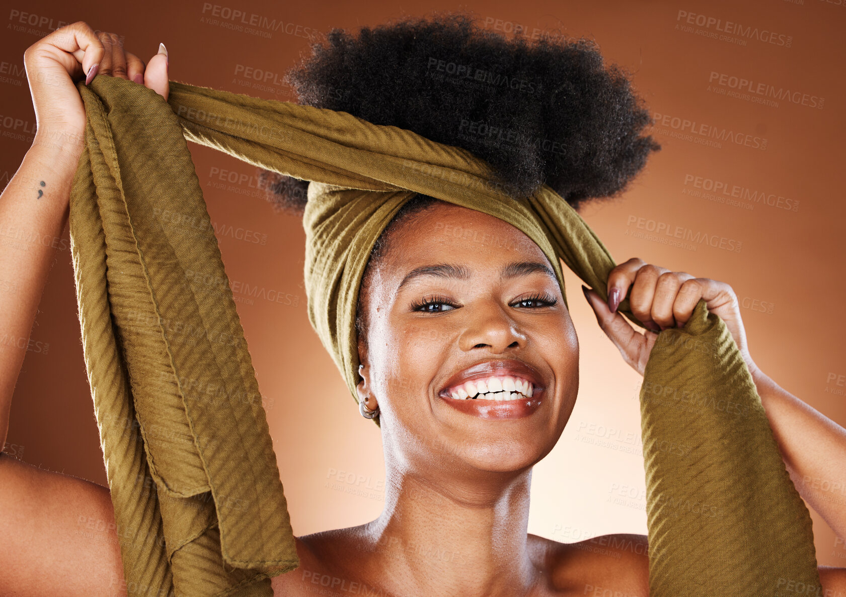 Buy stock photo Beauty, black woman and portrait with afro hair wrap for protection, style and african fashion. Natural, happy and healthy hair care of skincare model on brown studio background with smile.

