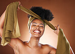 Black woman, african head wrap and hair care of a model with healthy skincare and natural beauty. Fabric, and scarf hairstyle wrapping of a woman happy about afro, cosmetics and wellness treatment