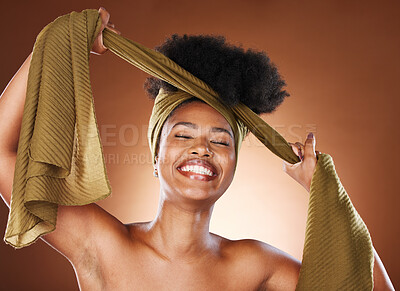 Buy stock photo Black woman, african head wrap and hair care of a model with healthy skincare and natural beauty. Fabric, and scarf hairstyle wrapping of a woman happy about afro, cosmetics and wellness treatment