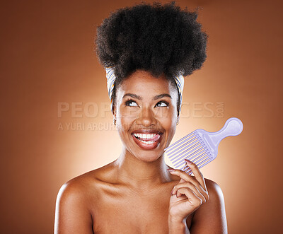 Buy stock photo Hair care, comb and black woman with smile, natural beauty or stylish for wellness on brown studio background. Afro, African American female or girl with headscarf, body care or skincare or face glow