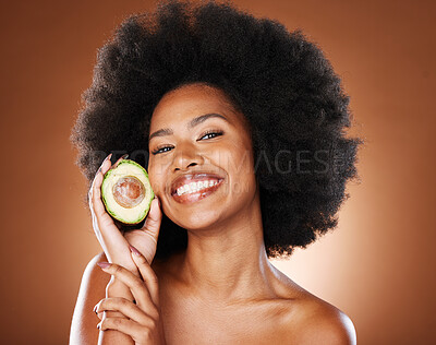 Buy stock photo Avocado, black woman model or skincare beauty for afro smile, cosmetics wellness or skin nutrition in studio background. Happy portrait of girl holding fruit, food or healthy facial organic treatment