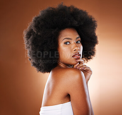 Buy stock photo Beauty, hair care and black woman with skincare, portrait and facial makeup in brown studio background.  Portrait of African American female with afro, cosmetics and skin for healthy facial treatment