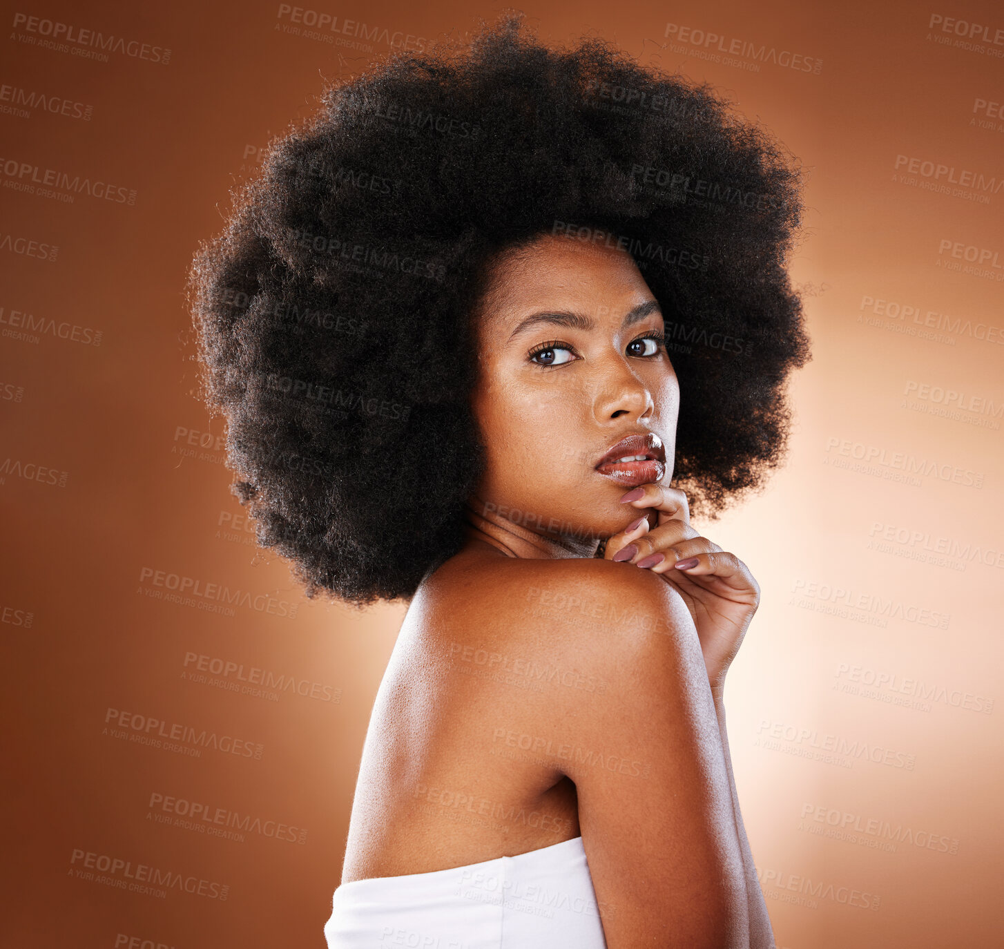 Buy stock photo Beauty, hair care and black woman with skincare, portrait and facial makeup in brown studio background.  Portrait of African American female with afro, cosmetics and skin for healthy facial treatment