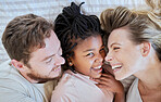 Family, love and bed fun of a mom, dad and adopted girl laughing with a funny time at home. Portrait of a child with mama and father together with a smile bonding with parent care in a house bedroom