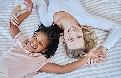 Buy stock photo Mother, adoption and child lying on bed with smile for quality family bonding time together at home. Happy mom holding adopted kid smiling and relax in happiness for playful fun in the bedroom above