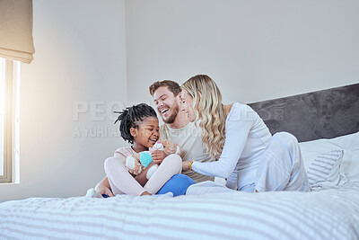 Buy stock photo Interracial, adoption family and bed with smile, happiness and bonding together with kid, home and love. Diversity, happy family and sitting in bedroom with child, african girl and parents in house