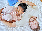 Family, portrait and smile while on bed to relax, love and trust after adoption with father and foster child in home bedroom for quality time. Man and girl from top while bonding, happy and together