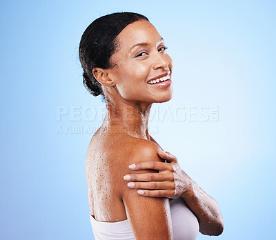 Buy stock photo Black woman, shower and wet body on blue background for skincare, beauty and wellness, personal hygiene and self care in studio. Portrait happy young african model, water drop and clean body care 