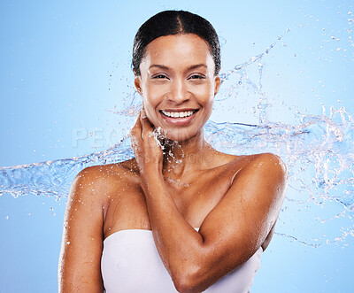 Buy stock photo Black woman, water splash and woman skincare moisturizing skin, natural body wellness and liquid detox cleaning routine. Sustainable cosmetics health, washing skin and smile on a blue wall background