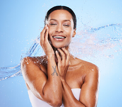 Buy stock photo Shower, water and black woman with splash and beauty, grooming and hygiene with clean and wet against blue studio background. Natural cosmetics, fresh and hydration, wellness and healthy skin mockup.