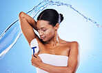 Black woman, water splash and shaving armpit with cream for skincare body health, cosmetics hygiene and beauty grooming routine. Self care, hair removal and self love studio mockup on blue background