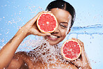 Grapefruit, black woman and water splash, vitamin c, beauty skincare and wellness, healthy body and aesthetics, natural cosmetics and face on studio background. Portrait model, wet citrus and detox