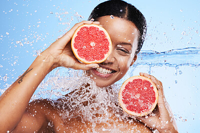Buy stock photo Grapefruit, black woman and water splash, vitamin c beauty and skincare wellness, healthy body and aesthetics, natural cosmetics and face on studio background. Portrait model, wet citrus and detox 