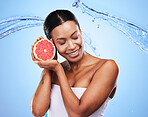 Water splash, fruit and skincare of a black woman holding grapefruit, diet food and nutrition. Vitamin c, cosmetic health and wellness of a model with water happy about zen beauty and healthy eating